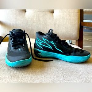 Puma Melo basketball shoes.